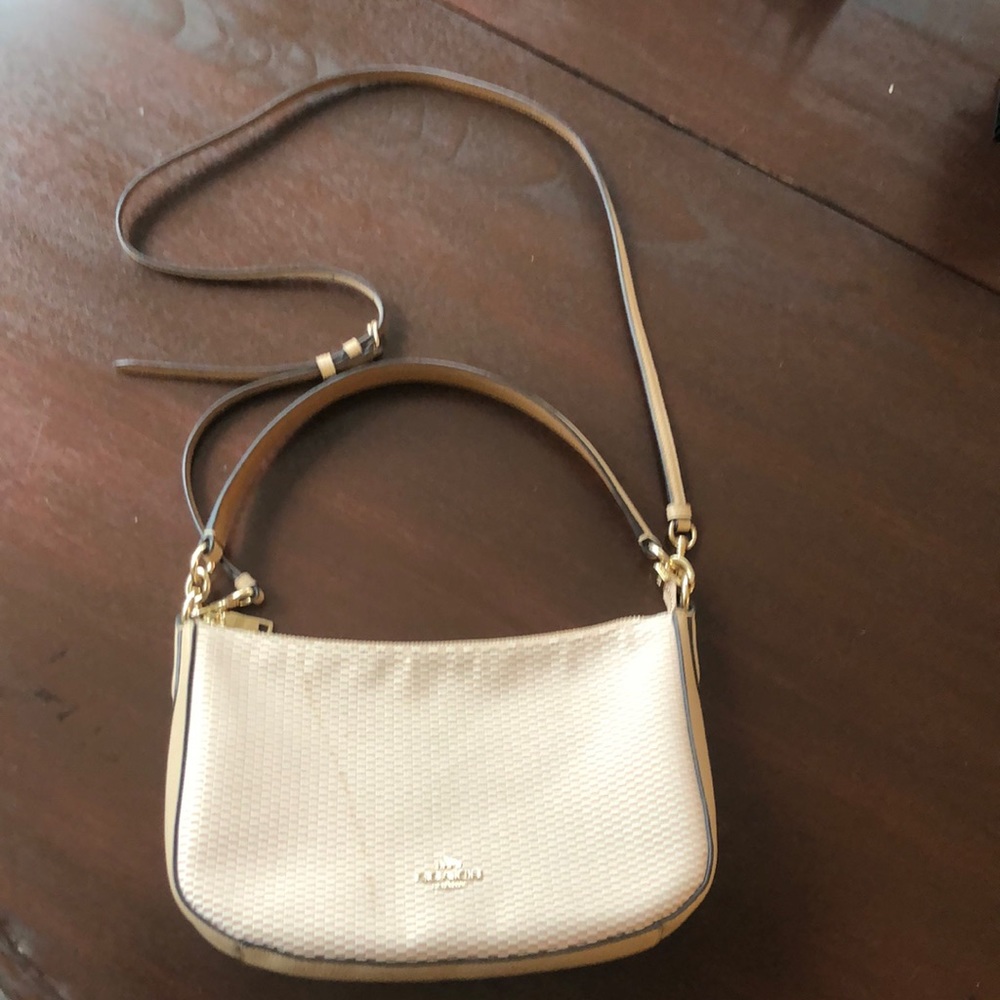 Coach purse with crossbody strap.